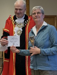 Sue Place collects W E Evans Memorial Cup for best exhibit in vases of daffodils.