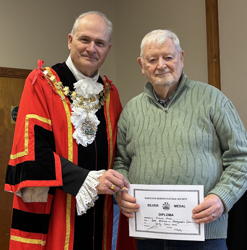 Richard Webb receives award for best exhibit in photography.